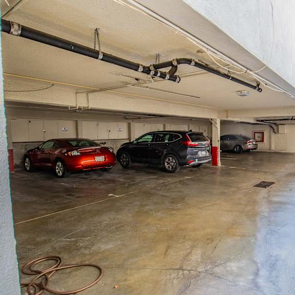 a parking garage with cars parked in it