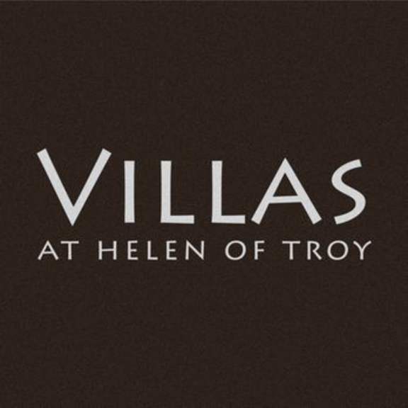 the white vilas at hell of troy font on a black background