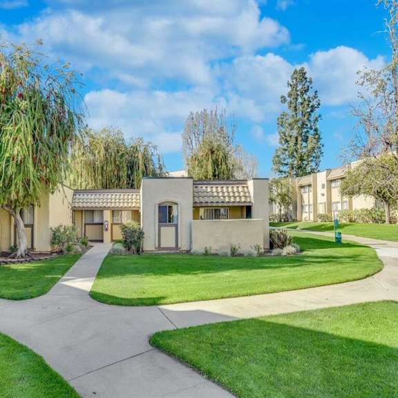 a house with a tree in front of it