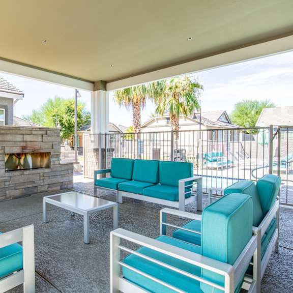 the preserve at ballantyne commons living room with couches and a fireplace at villas on olive, peoria, arizona