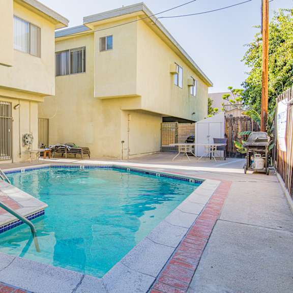 a swimming pool in front of a house