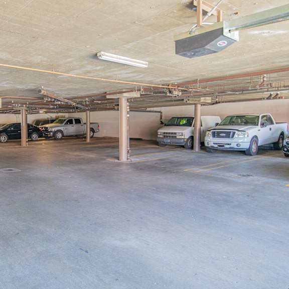 a parking garage with cars parked in it
