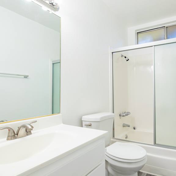 a bathroom with a sink toilet and a shower