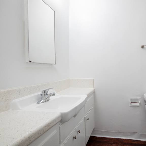 a bathroom with a sink toilet and a shower