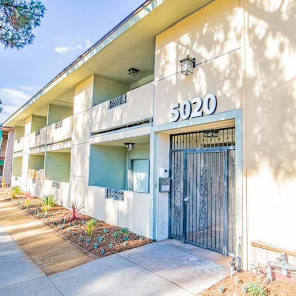the entrance to an apartment building with a door