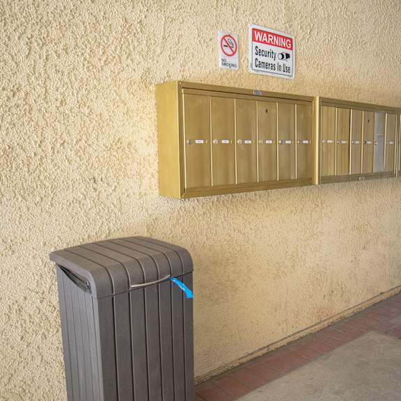 a room with a radiator and a no smoking sign on the wall