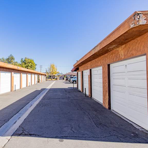 a long row of garage doors are closed.
