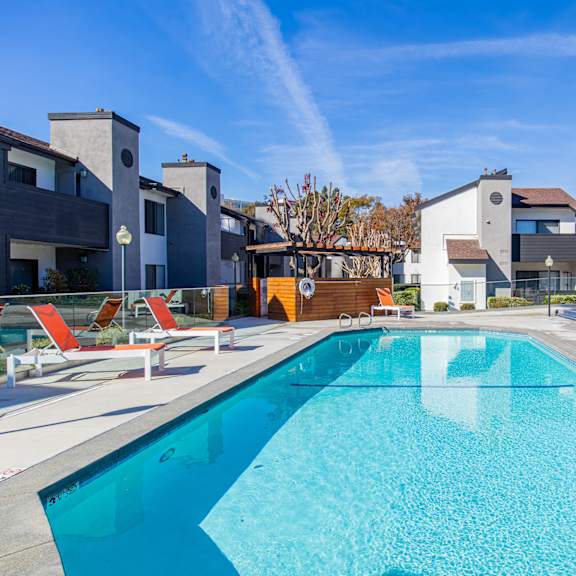 our apartments have a large swimming pool with apartments in the background