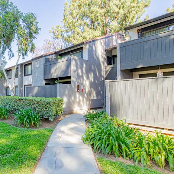 a concrete building with a green lawn in front at metro 3610, riverside, 92505
