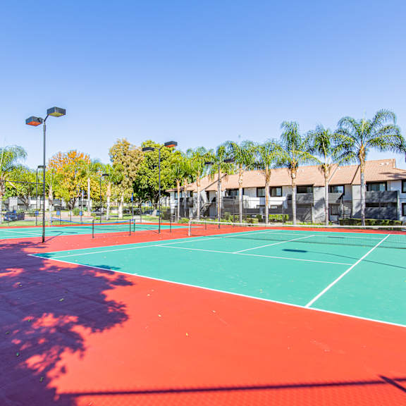 a tennis court with a red and green surface at metro 3610, riverside, 92505