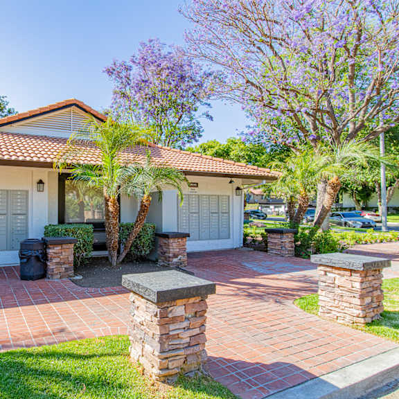 a house with a red tiled roof and a white garage door at metro 3610, riverside, 92505