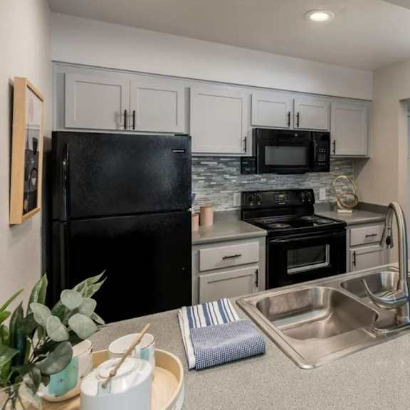 kitchen with black appliances at sofia apartments, tempe, 85283