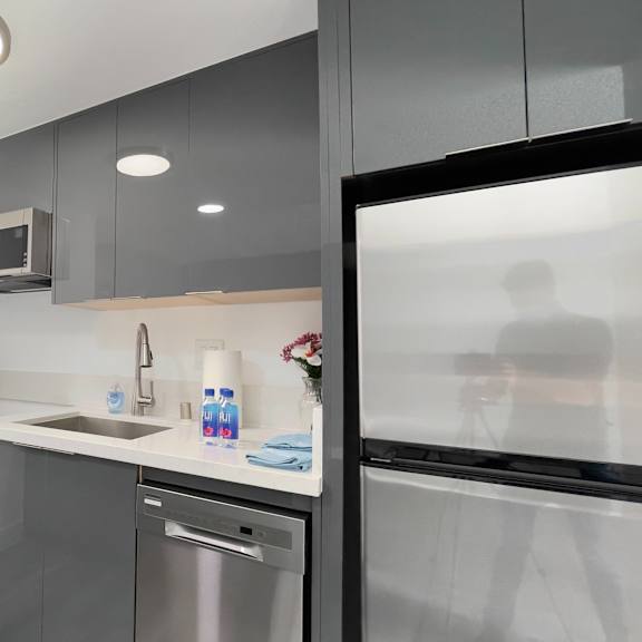 a kitchen with a sink and a refrigerator