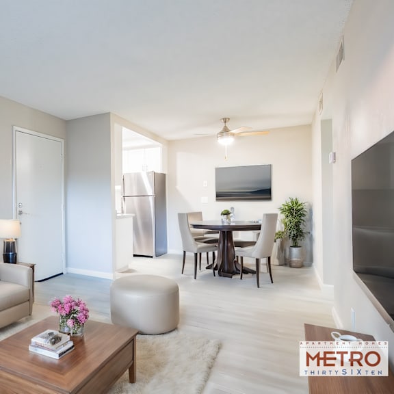 a living room and dining room with a couch and a table at metro 3610, california