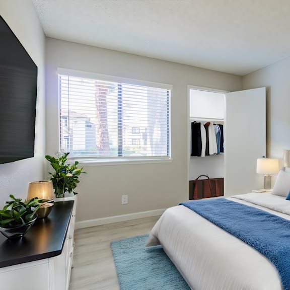 a bedroom with a bed and a dresser and a window at metro 3610, california