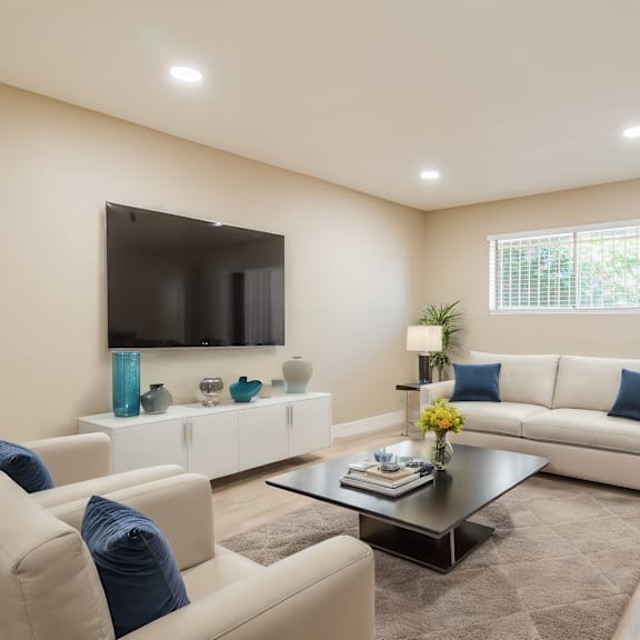 a living room with couches and a coffee table
