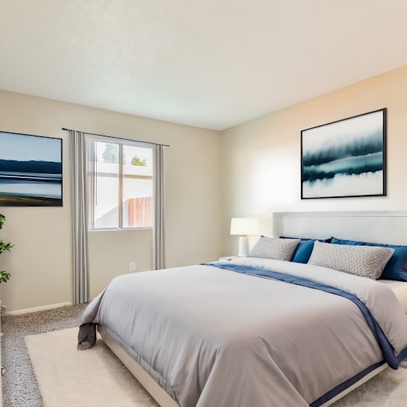 a bedroom with a bed and a window