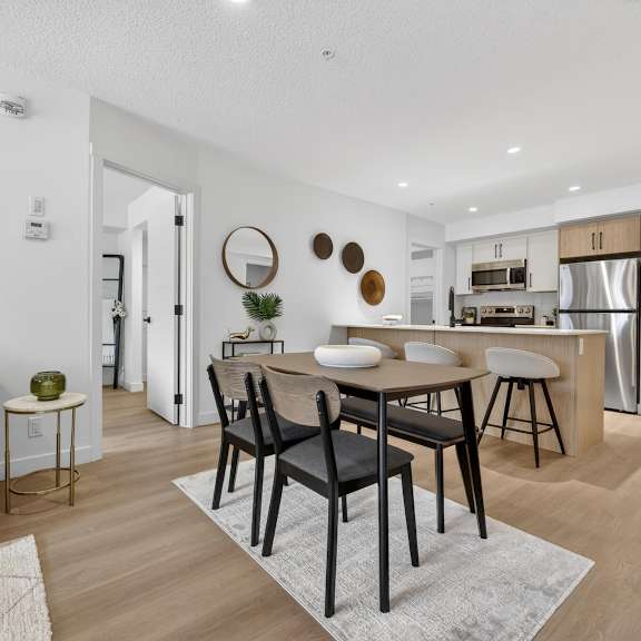 a modern living room with a bar area and a television.
