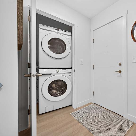 a small room with a washer and dryer in it.