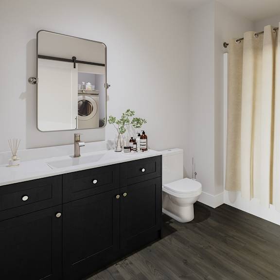 a bathroom with a toilet and a sink and a mirror