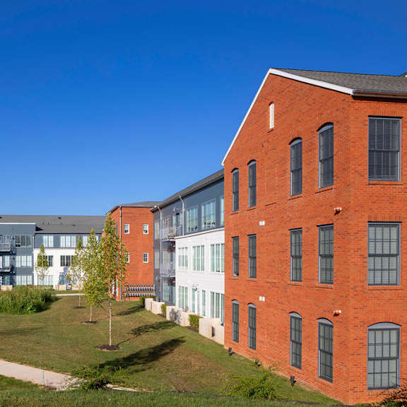 a red brick building with a clear blue sky in the background.