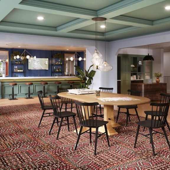 a dining room with a table and chairs