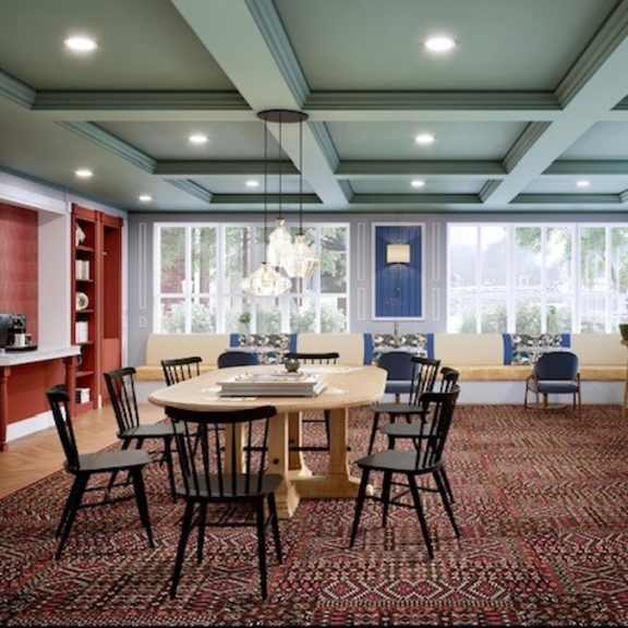 a large dining room with a table and chairs