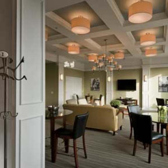 a dining room with a table set for six.