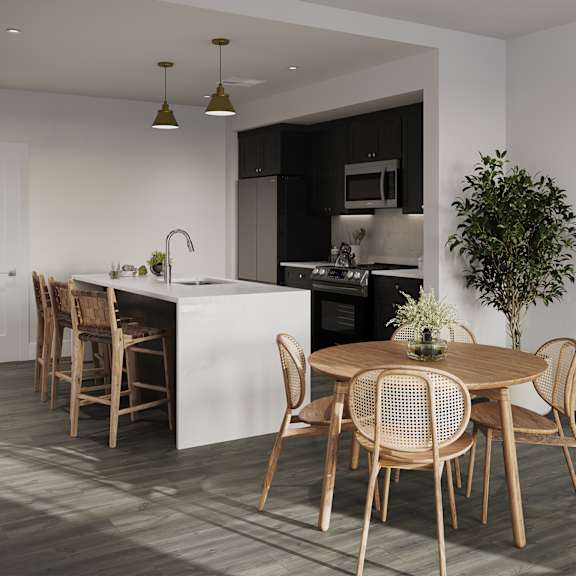 a kitchen and dining room with a table and chairs