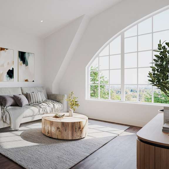 a living room with a couch and a round coffee table