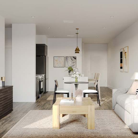 a living room and dining room with a couch and a table