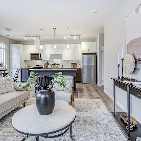 living room with a couch and a table  at 101 base line road west, ontario