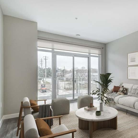 living room with a white couch and a large window  at 101 base line road west, london, on