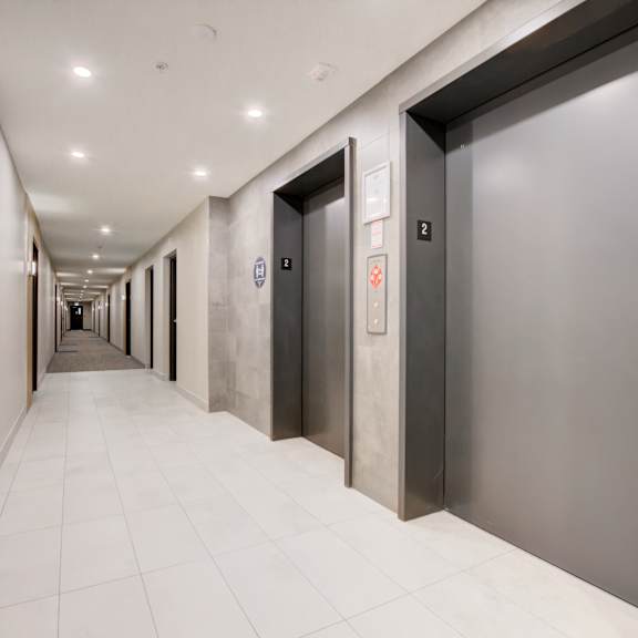 a row of elevators in an office building