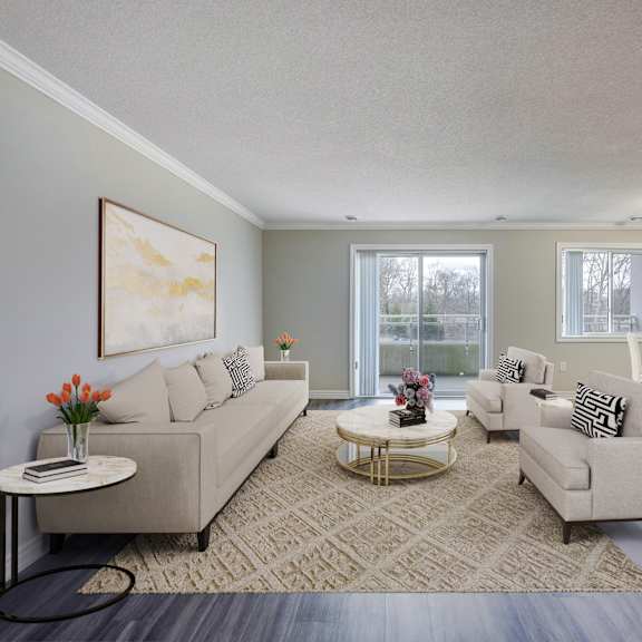 a living room with couches and chairs