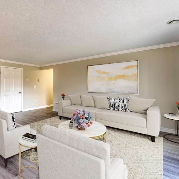 a living room with couch and two chairs