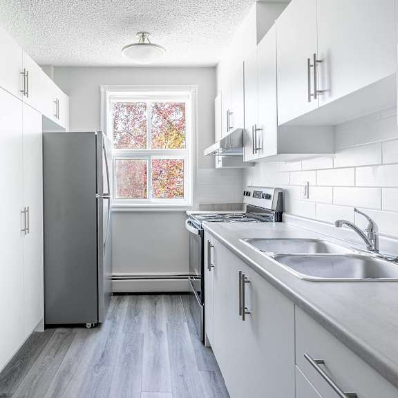 modern grey and white kitchen at oakland, subway tile backsplash