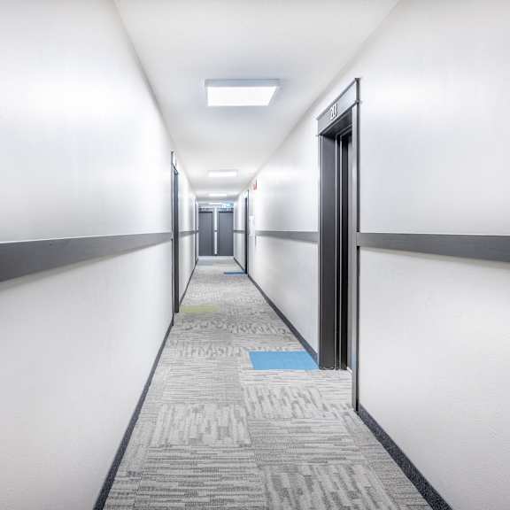 common area hallway at oakland with a blue square on the floor.