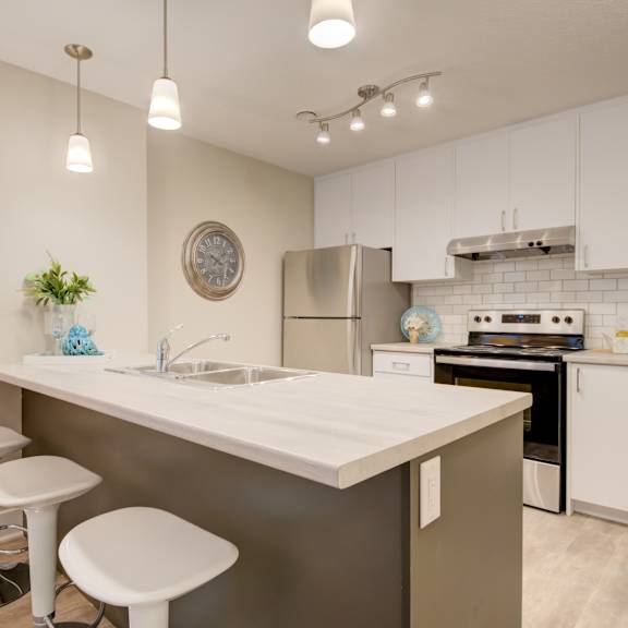 kitchen with white cabinets and an island.