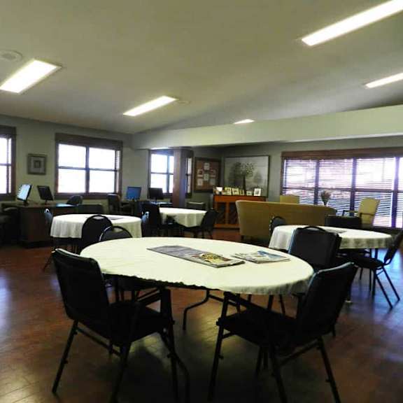 a room with tables and chairs is set up for an event.