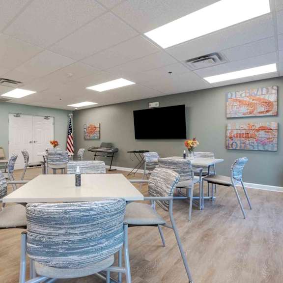 a conference room with a long table and chairs.
