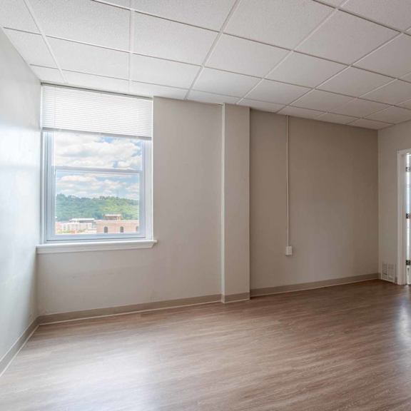a room with a window and a door.