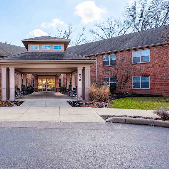 a large brick building with a covered walkway entrance.