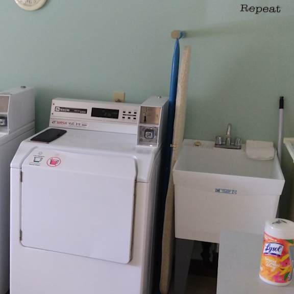 a small laundry room with a washer and dryer.