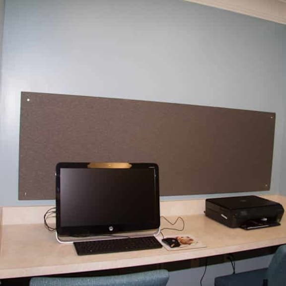 a laptop is on a desk with a mouse and a mouse pad.