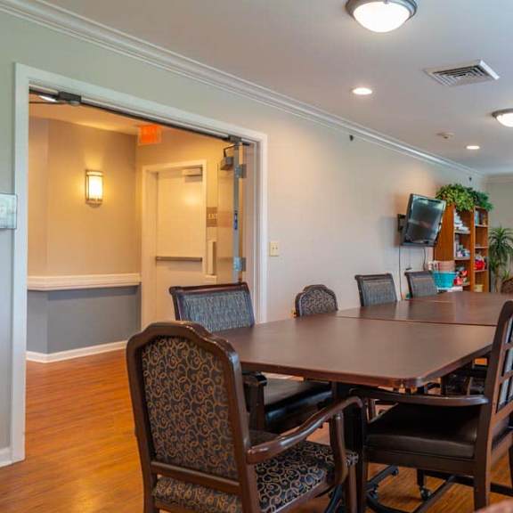 a dining room with a table and chairs.
