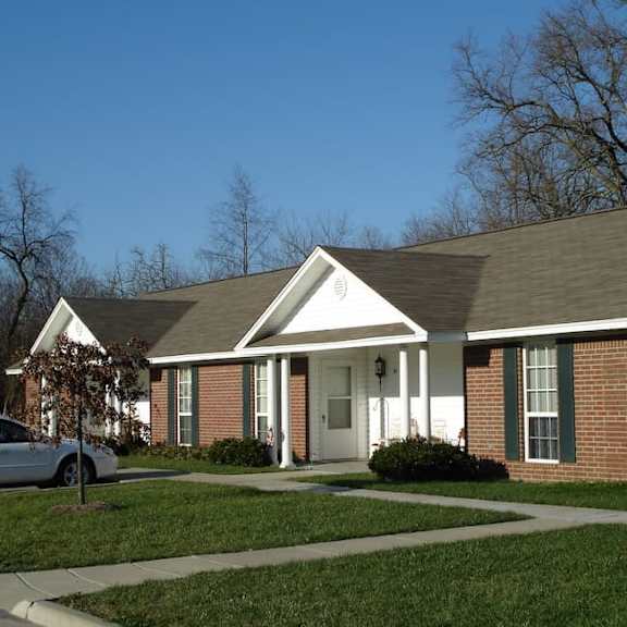 a house with a car parked in front.