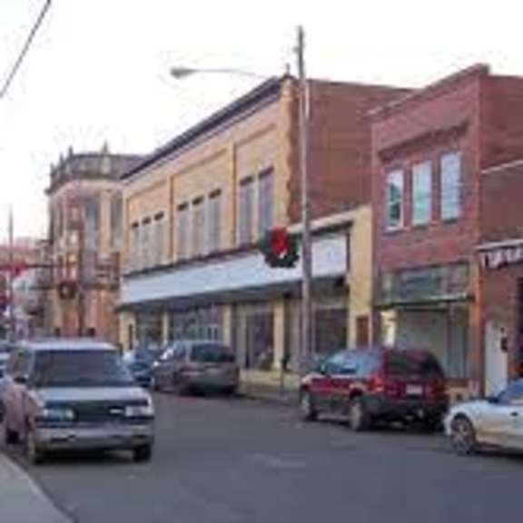 cars are parked on the side of the street.