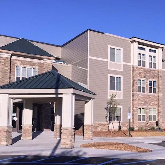 a large building with a covered walkway entrance.