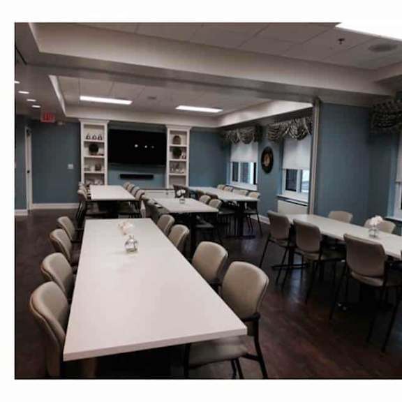a conference room with a long table and chairs.